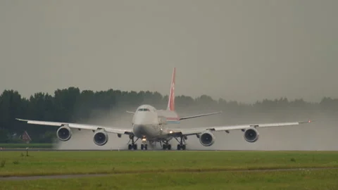 Boeing 747 on the runway in the rain Stock Footage 315467297