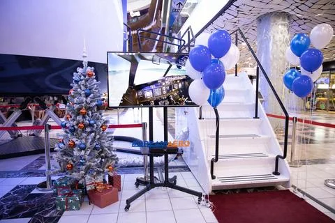 A Boeing 747 training simulator for pilots in a shopping mall. The cabin of the Stock Photos