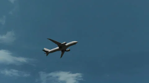 Boeing 787 airliner climbing against beautiful sunny cloudy sky, no logo, 4K Stock Footage