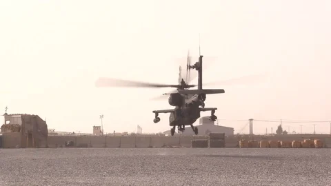 Boeing AH-64 Apache helicopters stop to refuel at a Forward Operating Base -2018 Stock Footage 89239410