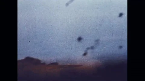 Boeing B-17 Flying Fortresses flying in formation through the barrage Stock Footage