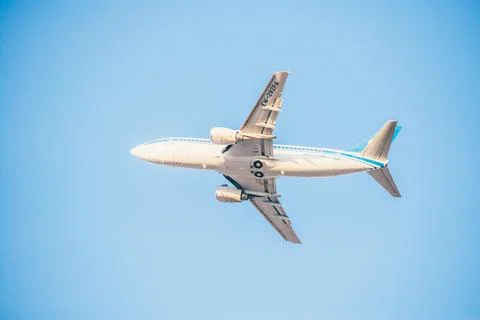 Boeing in the sky on a blue background Stock Photos