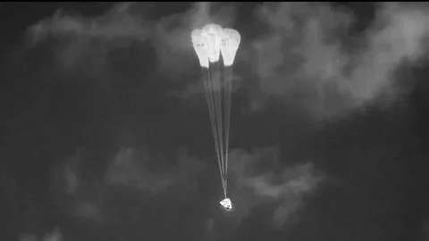 Boeing Starliner spacecraft three main parachutes deploy for landing Video stock 284327484