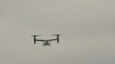 Boeing V-22 Osprey helicopter flies over the beautiful ocean coast. Stock Footage 106324778