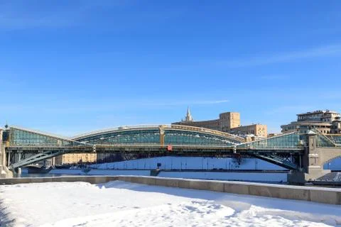 Bogdan Khmelnitsky pedestrian bridge and snow-covered embankment Stock Photos
