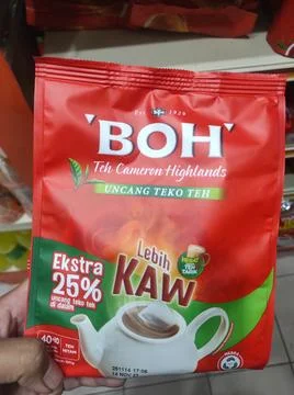 BOH Black Tea Package Held by Hand Stock Photos