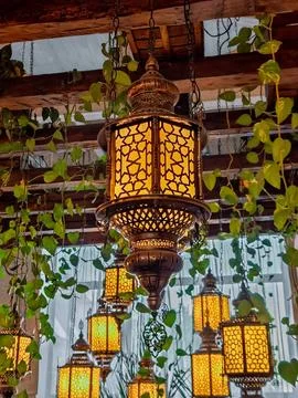 Boho-Chic Interior: Ornate Moroccan Lanterns with intricate patterns intert.. Stock Photos