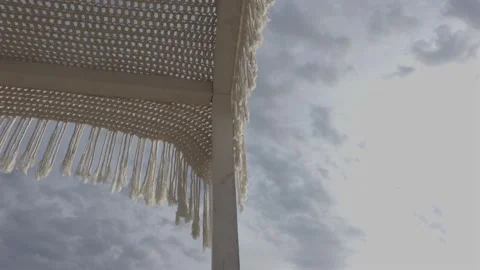 Boho Macrame Canopy Moving in Wind Against Cloudy Sky in Saranda, Albania - Low Stock Footage 344292681