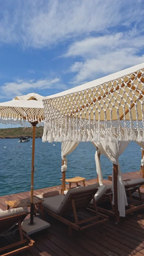 Boho Macrame Umbrella Beach Cabana Deck 4K Cinematic Stock Footage 339706212