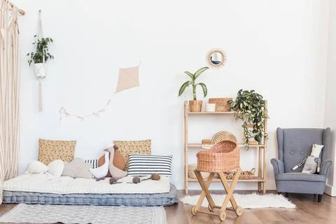 Boho style interior design featuring a cozy seating area with cushions, a wooden Stock Photos