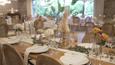 Boho wedding reception banquet table with pampas grass roses and candles Stock Footage 333021877