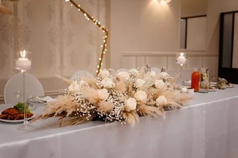 Boho wedding table set. vintage dining table with decorations, flowers and Stock Photos