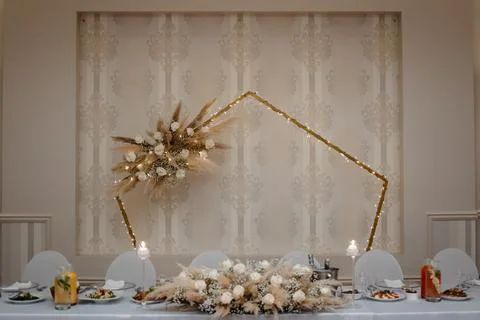 Boho wedding table set with the wedding hexagon arch, vintage dining table with Stock Photos