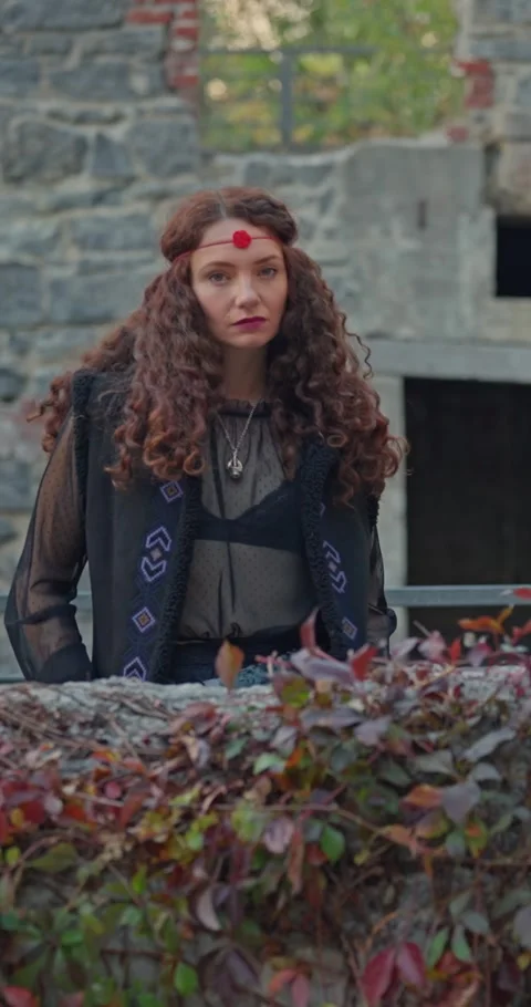 Boho Witch With Intense Gaze And Abandoned Historic Building In Background Stock Footage 331095885