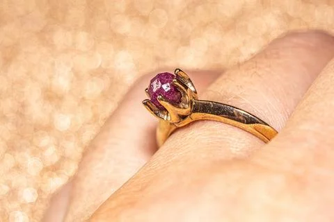 Boho yellow gold ring with ruby Stock Photos