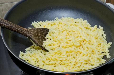 Boil macaroni in a pot Stock Photos