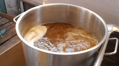 Boil malt grain in a pot (Fermentation of grain ) Stock Footage 53301605