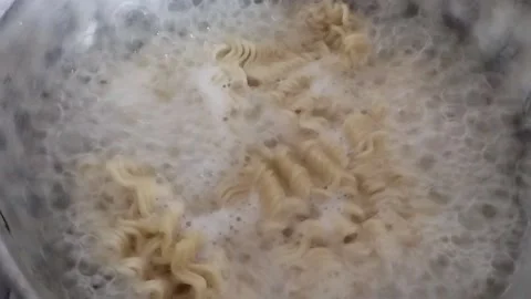 Boil noodles in a pot Stock Footage 219304837