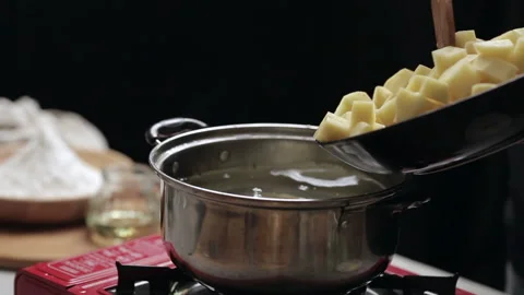 Boil potatoes to make mashed potatoes. Stock Footage 152242764