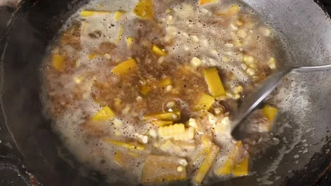 Boil pumpkin with corn Stock Footage 341931412
