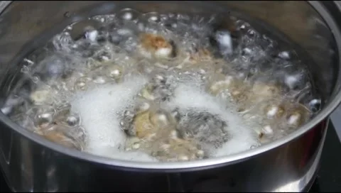 Boil quail eggs in a pan with boiling water Stock Footage 312095608