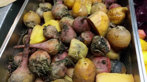 Boiled and peeled fresh candy stripe, golden and purple beetroots, at a resta Stock Footage 59198414