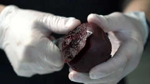 Boiled beets. Cook cooks beets. The cook is cleaning the beets Stock Footage 126447091