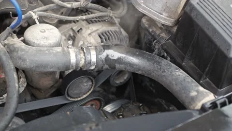 Boiled car engine. Unserviced car broke down. Smoke coming from under the hood Stock Footage 223564391