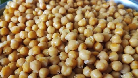 Boiled chickpeas are falling down from above Stock Footage 196844697