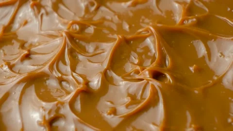 Boiled condensed milk texture or dulce de leche background. Stock Footage 336782349