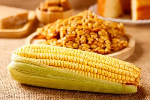 Boiled corn on the cob on a table featuring traditional Brazilian foods, wi.. Stock Photos