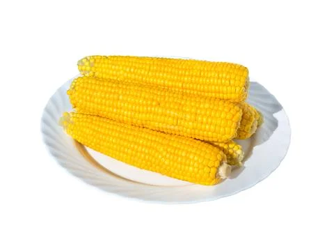 Boiled corn cobs on a white. Stock Photos