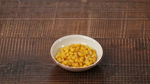 Boiled corn on plate Stock Footage 183560147