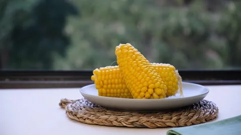 Boiled corn on a plate Stock Footage 287009323