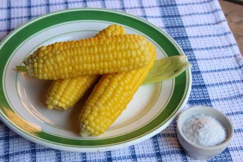Boiled corn on plate Stock Photos