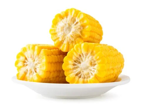 Boiled corn slices close-up on a white background in a plate slide. Isolated Stock Photos