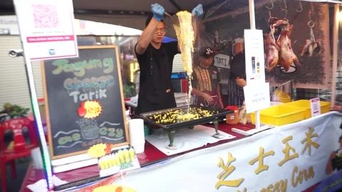 Boiled corn stall vendor Stock-Footage 276587035