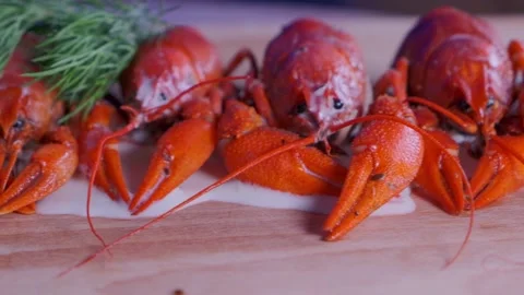 Boiled crayfish lie on the table with grass Stock Footage 179989598