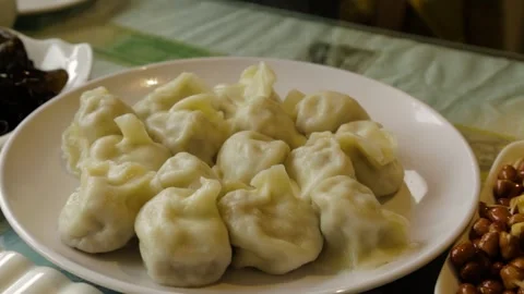 Boiled Dumplings and Side Dishes on Restaurant Table in Beijing, China Stock Footage 345745135