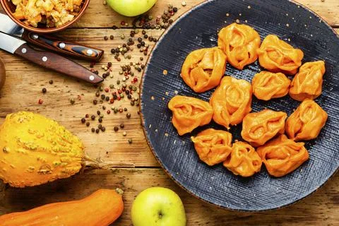 Boiled dumplings with pumpkin. Stock Photos
