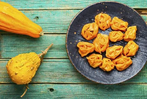 Boiled dumplings with pumpkin. Stock Photos
