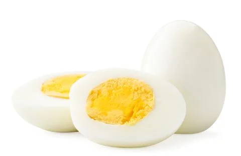 Boiled egg and two halves close-up on a white. Isolated Fotos Stock