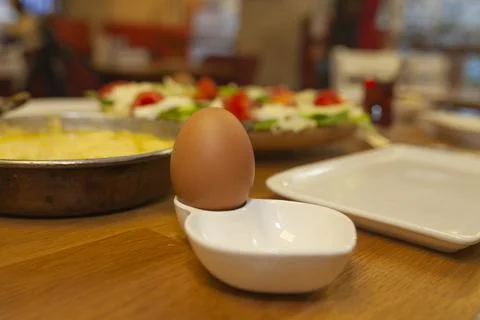Boiled egg. breakfast table in restaurant. Stock Photos