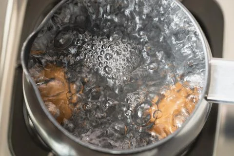 Boiled egg cooking close up Stock Photos