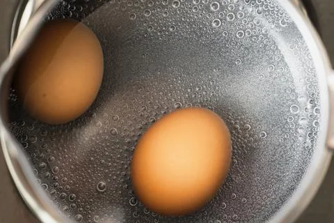 Boiled egg cooking close up Stock Photos
