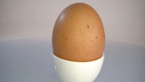 Boiled egg in a cup Stock Footage 157151427