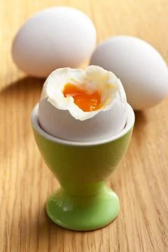 Boiled egg in eggcup Stock Photos