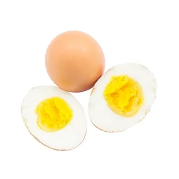 Boiled egg half cut with raw material on top view Foto stock