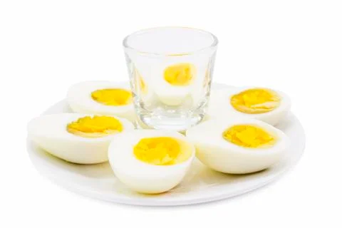 Boiled egg half cut snack on white plate Stock Photos