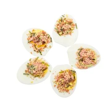 Boiled egg half cut with topping on top view Stock Photos